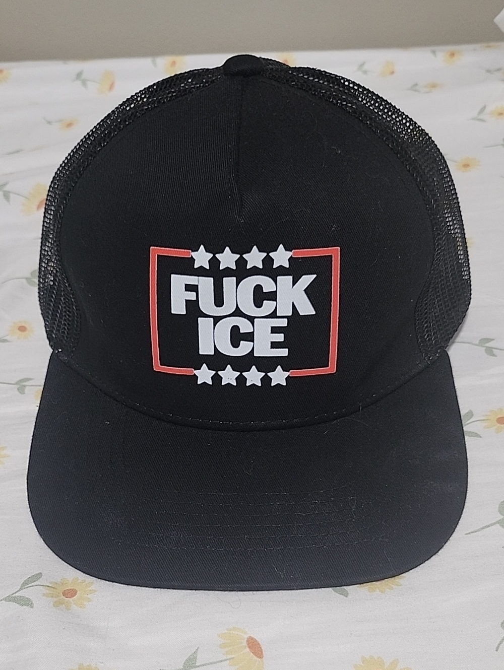 Black Trucker Hat with Bold White & Red Graphic